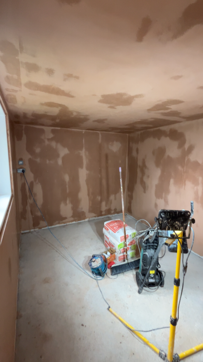Room part-way through re-plastering with equipment in place
