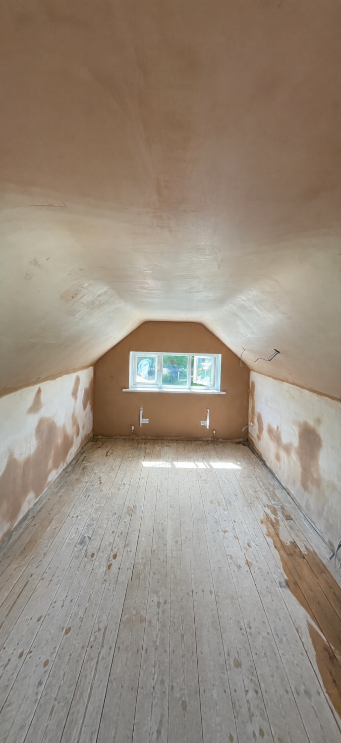Loft room with small window, freshly plastered