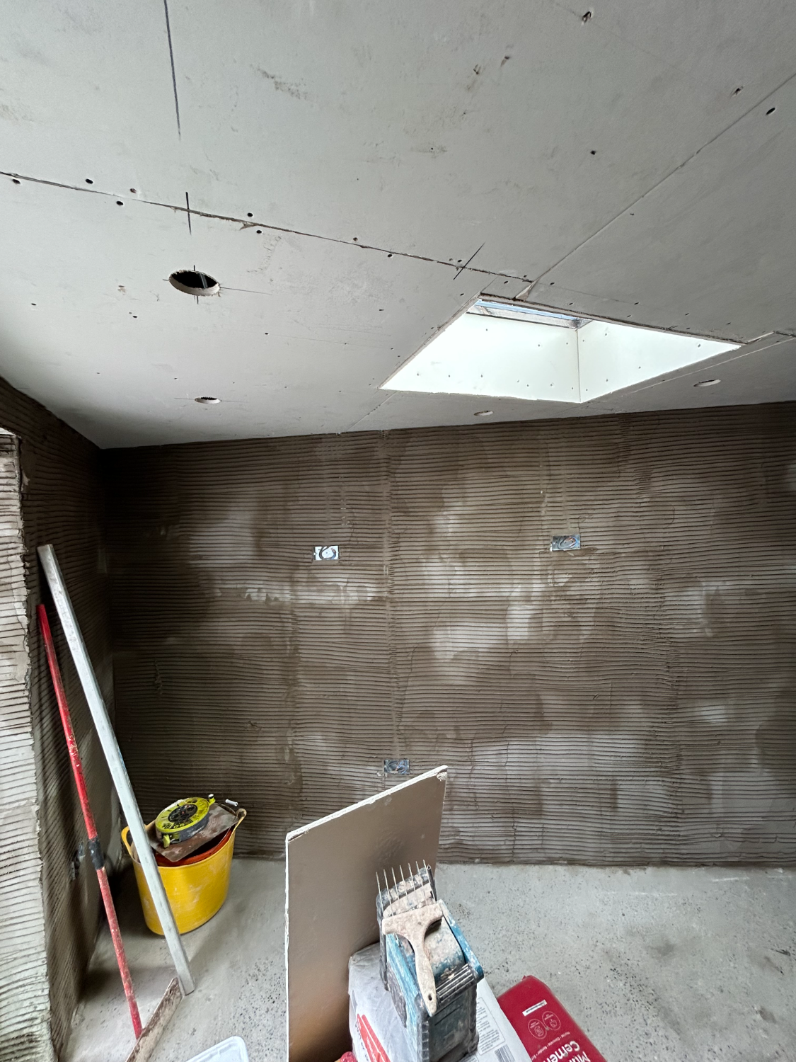 Room with new skylight and prepared walls