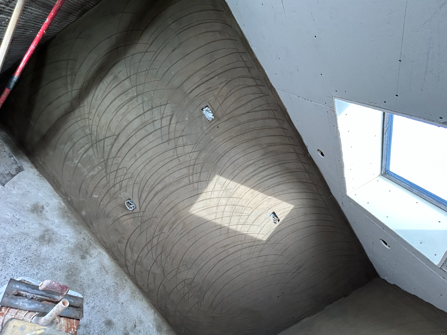 Close detail of a floated backing coat before skimming