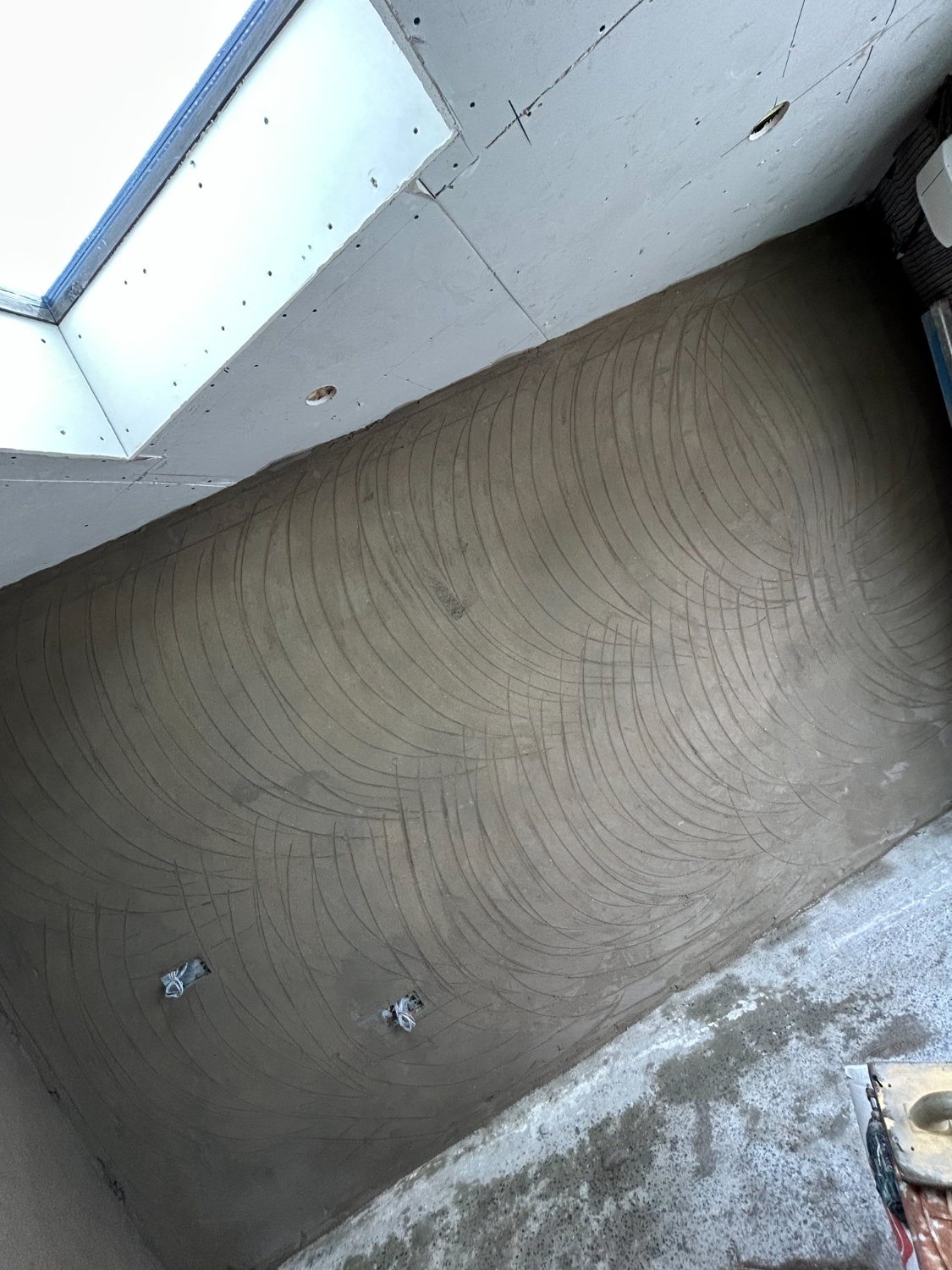 Floated wall surface beside a skylight