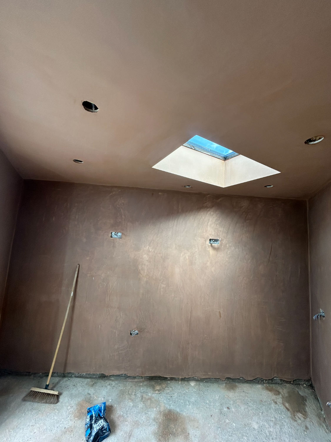 Finished plastered room with a skylight